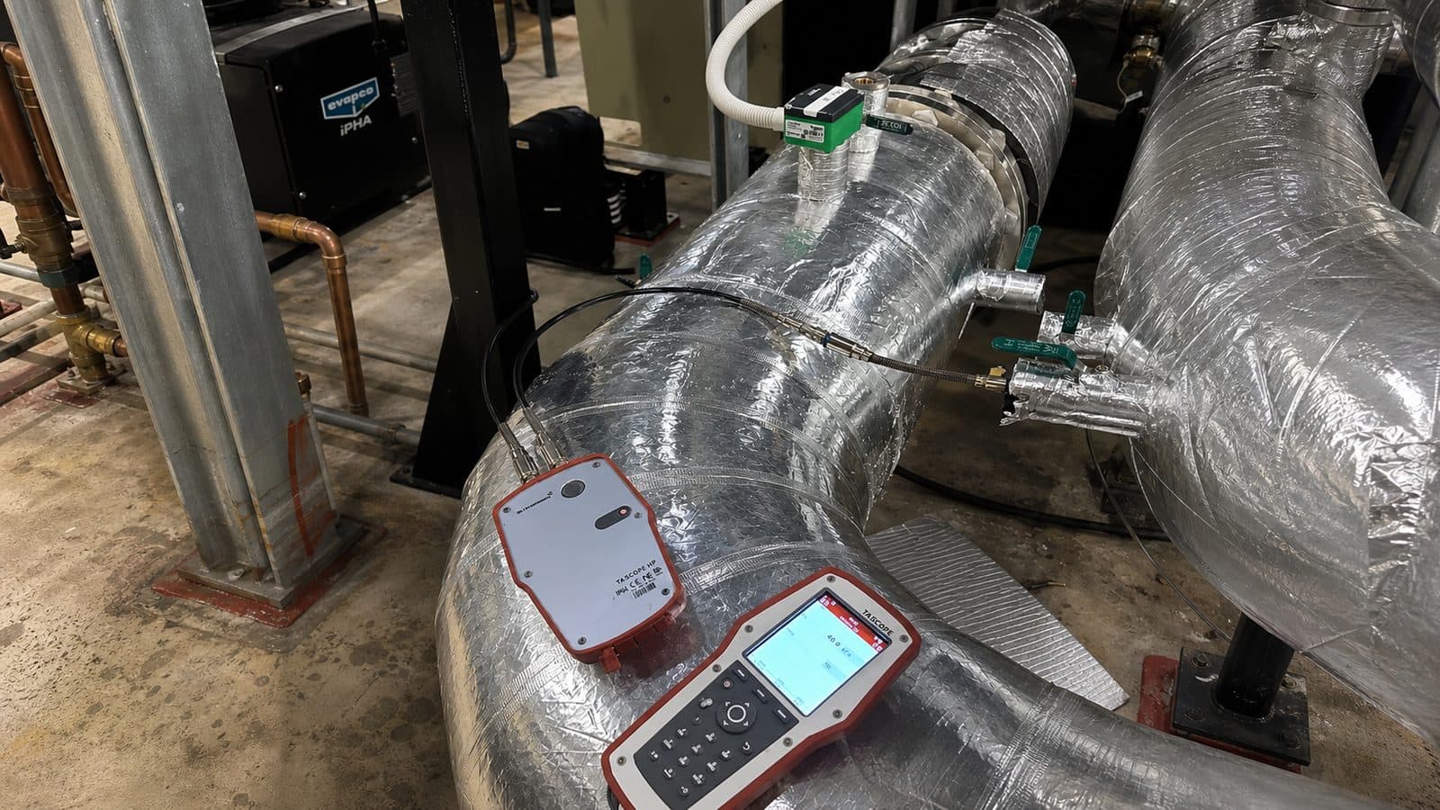 TA Scope balancing instrument recording commissioning data on insulated chilled water pipework at Westmead Hospital